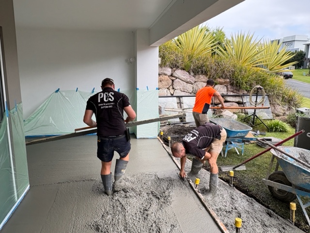 PCS crew screeding a fresh concrete slab on a Gold Coast job